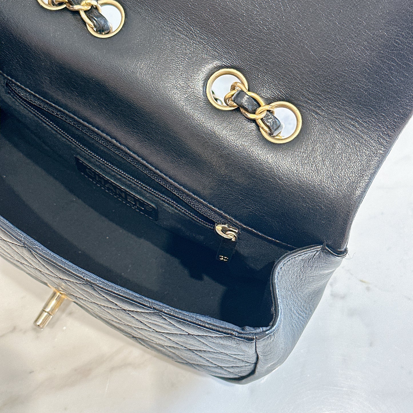 Chanel CC Braided Saddle Flap in Quilted Lambskin