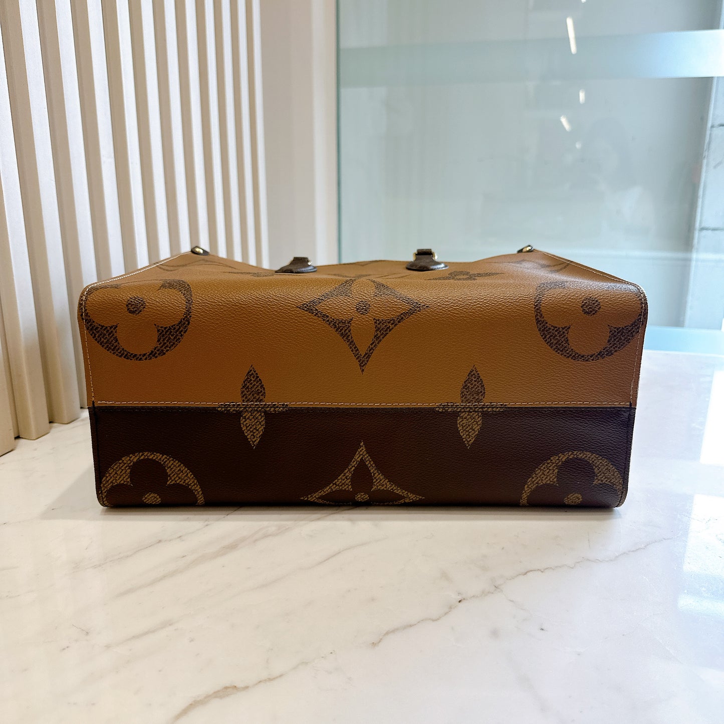 LV On The Go MM in Reverse Monogram