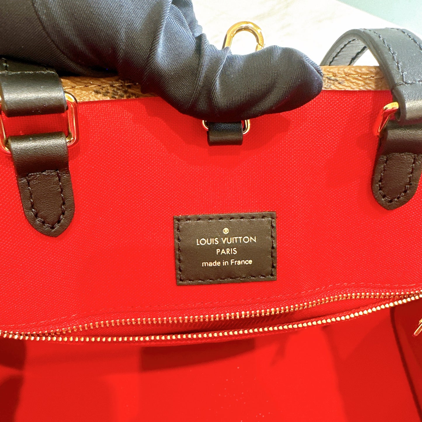 LV On The Go MM in Reverse Monogram