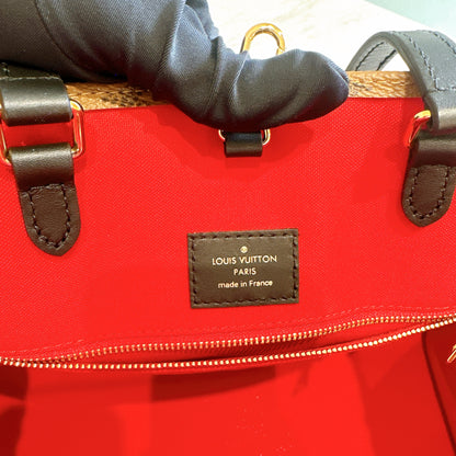 LV On The Go MM in Reverse Monogram