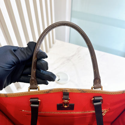 LV On The Go MM in Reverse Monogram