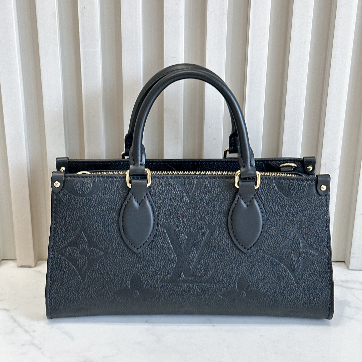 LV On the Go East West in Empriente Leather Black
