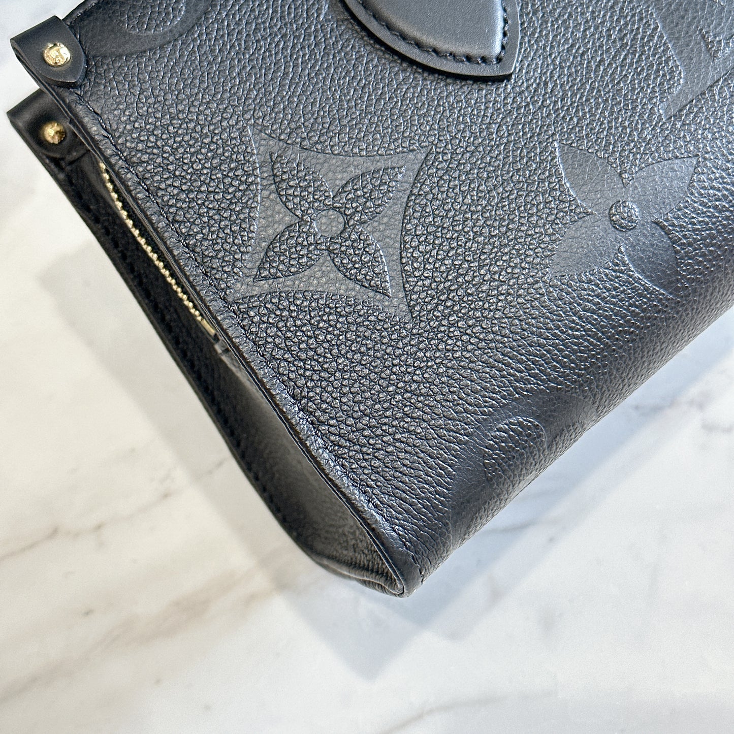 LV On the Go East West in Empriente Leather Black