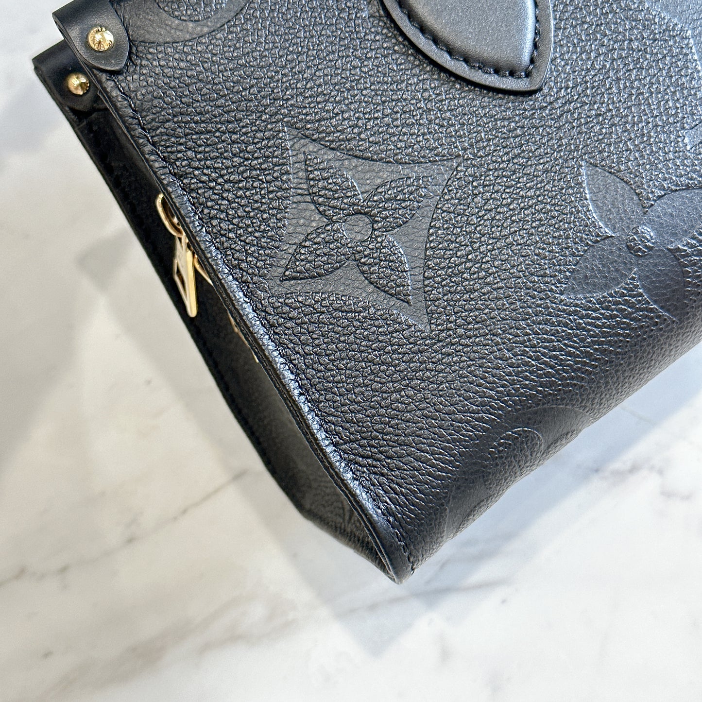 LV On the Go East West in Empriente Leather Black