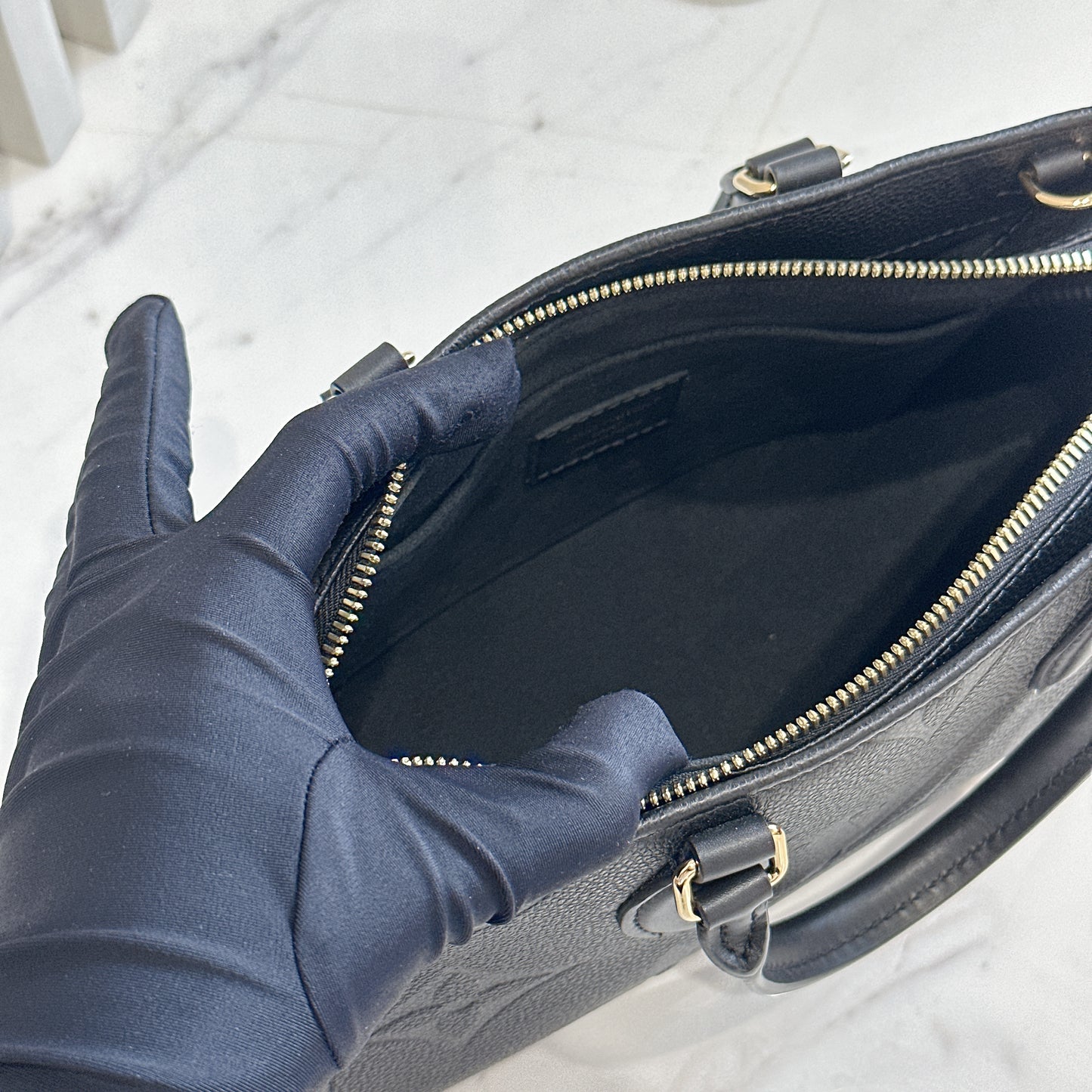 LV On the Go East West in Empriente Leather Black
