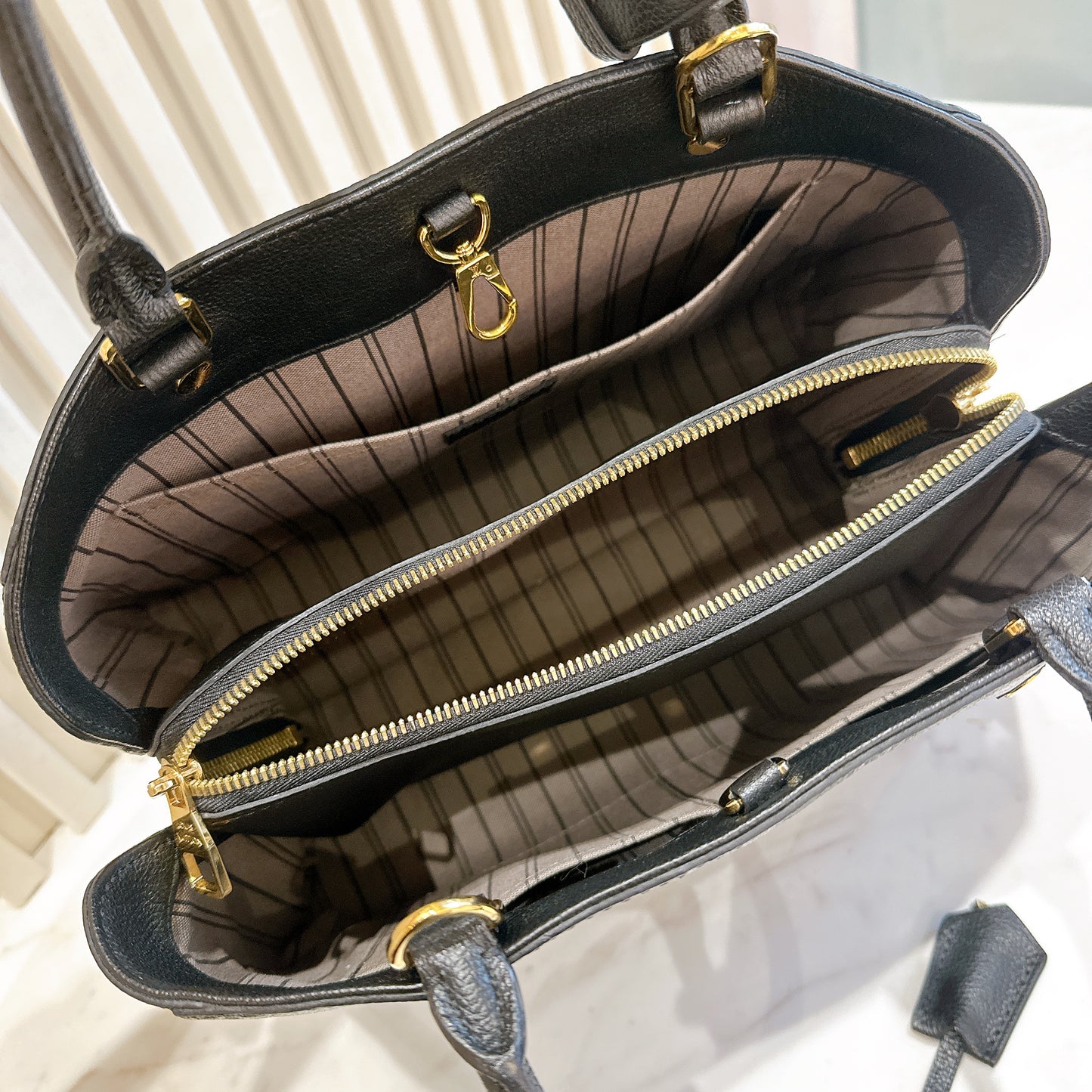 LV Montaigne MM in Black Empreinte Leather