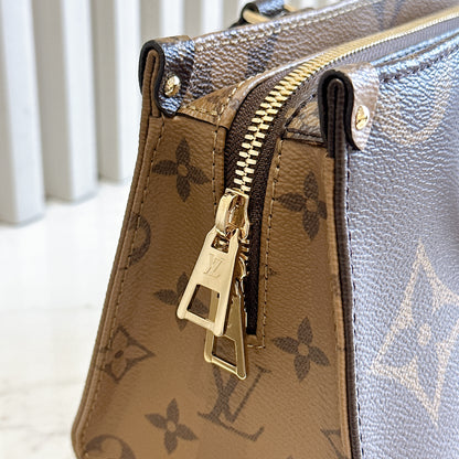LV On The Go East West Reverse Monogram
