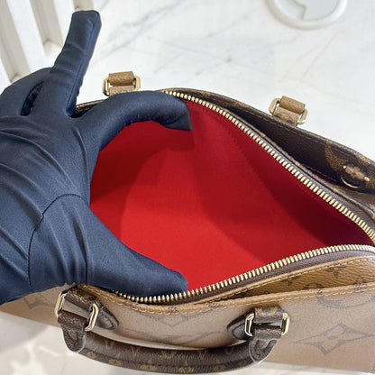 LV On The Go East West Reverse Monogram
