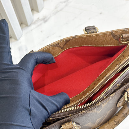 LV On The Go East West Reverse Monogram