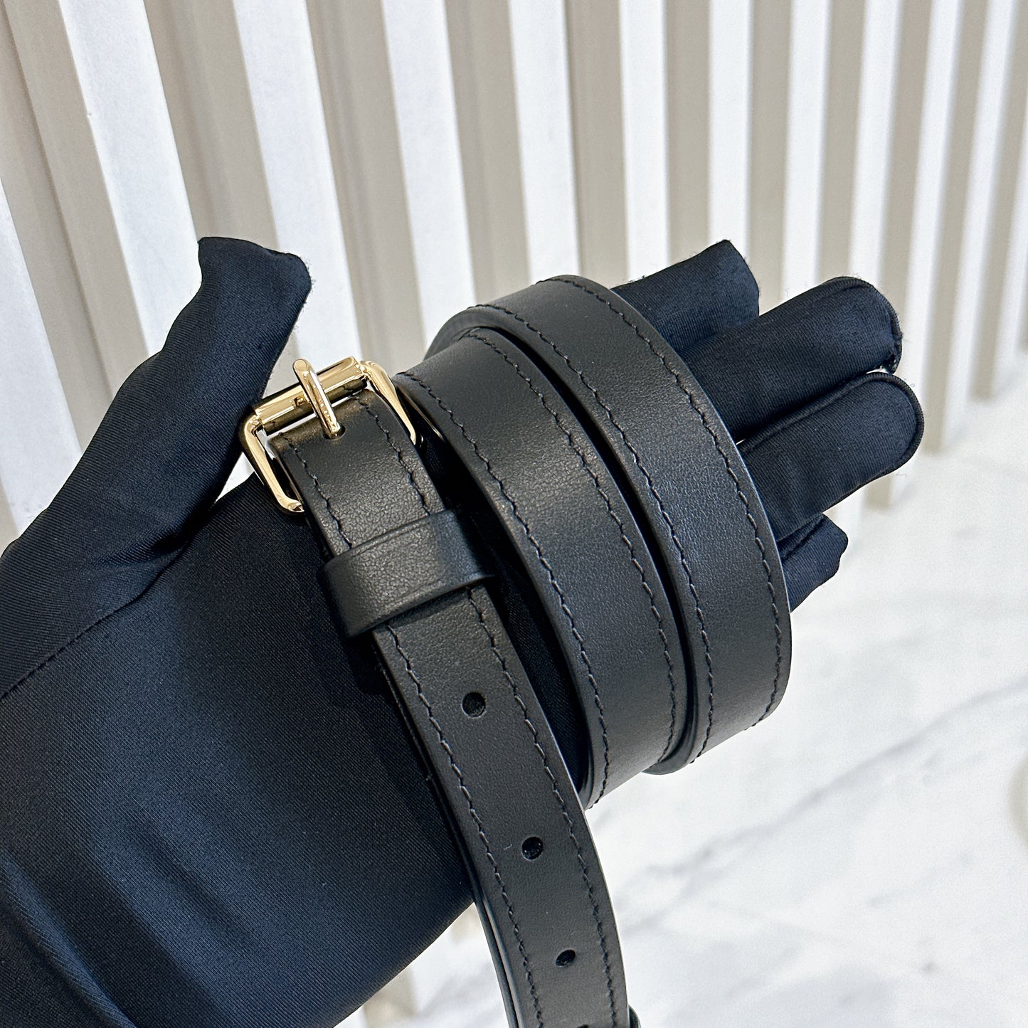 LV On The Go East West Reverse Monogram