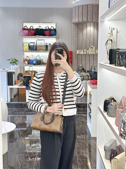 LV On The Go East West Reverse Monogram