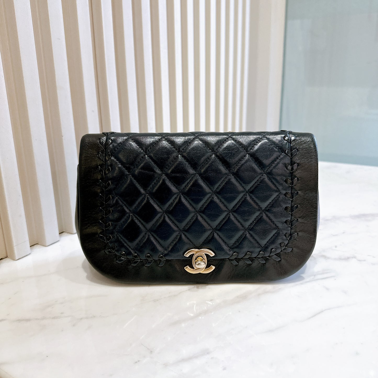 Chanel CC Braided Saddle Flap in Quilted Lambskin