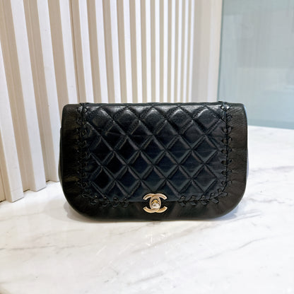 Chanel CC Braided Saddle Flap in Quilted Lambskin