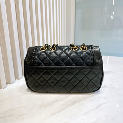 Chanel CC Braided Saddle Flap in Quilted Lambskin