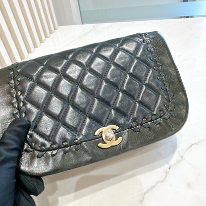Chanel CC Braided Saddle Flap in Quilted Lambskin