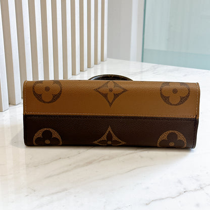 LV On The Go East West in Monogram Reverse
