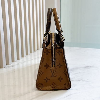 LV On The Go East West in Monogram Reverse