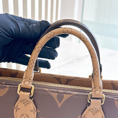 LV On The Go East West in Monogram Reverse
