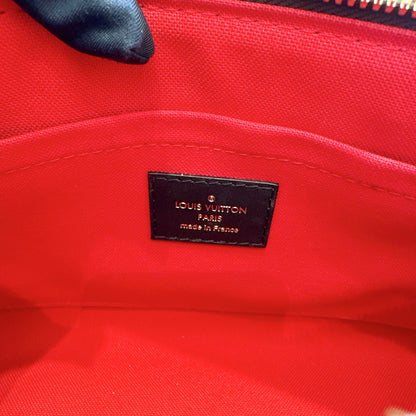 LV On The Go East West in Monogram Reverse