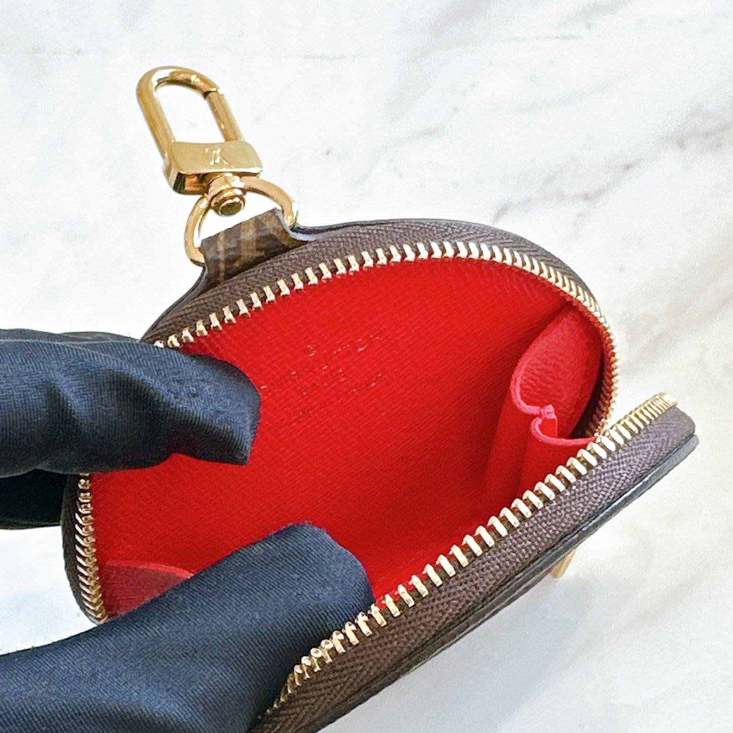 LV On The Go East West in Monogram Reverse