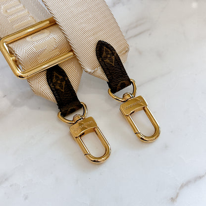 LV On The Go East West in Monogram Reverse