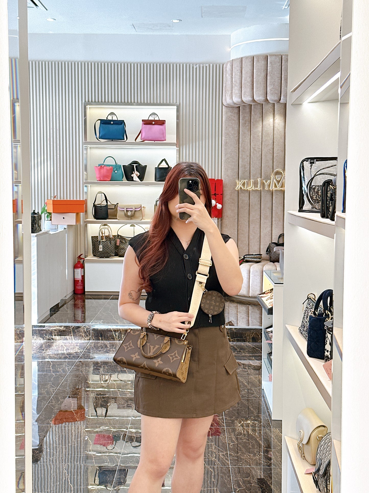LV On The Go East West in Monogram Reverse