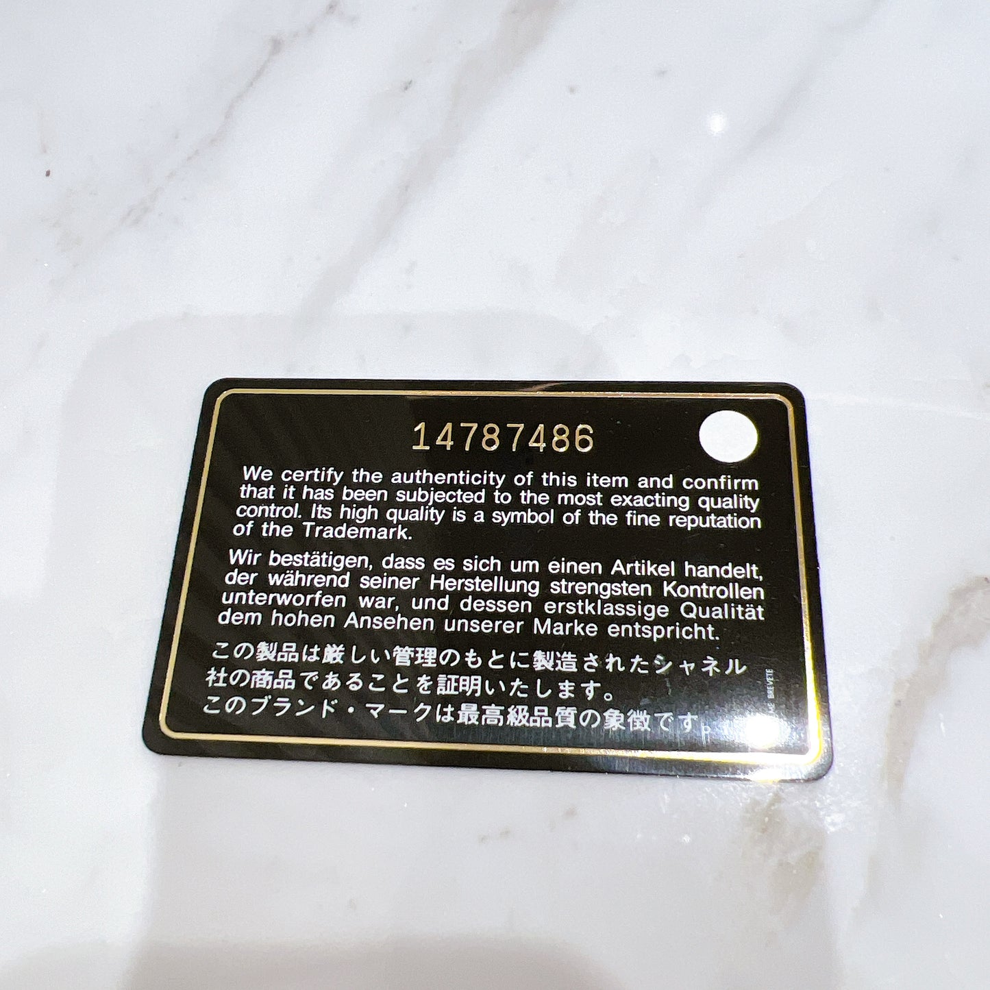 Chanel Patent Camellia Zippy Wallet