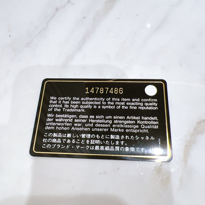 Chanel Patent Camellia Zippy Wallet