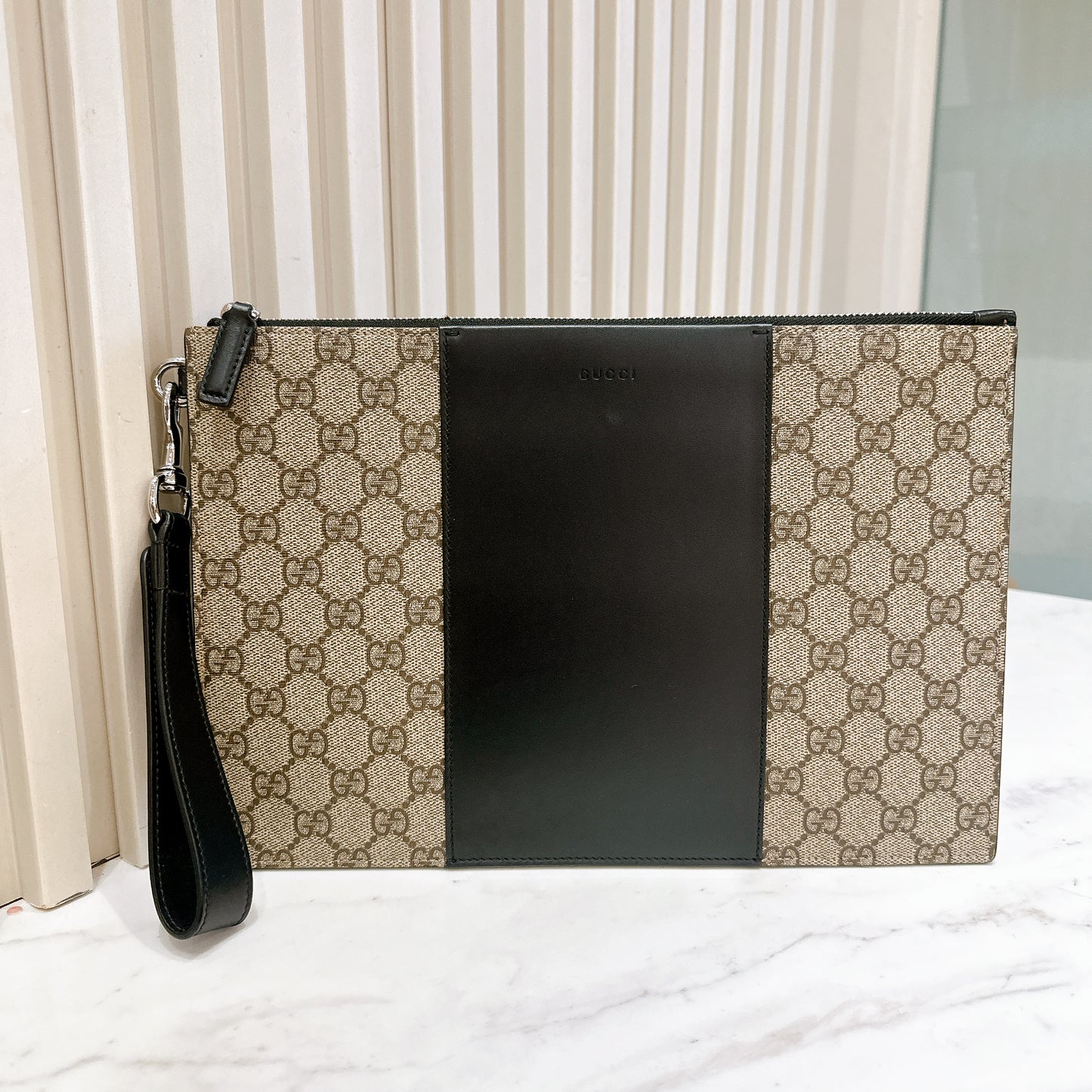 Gucci Supreme Clutch