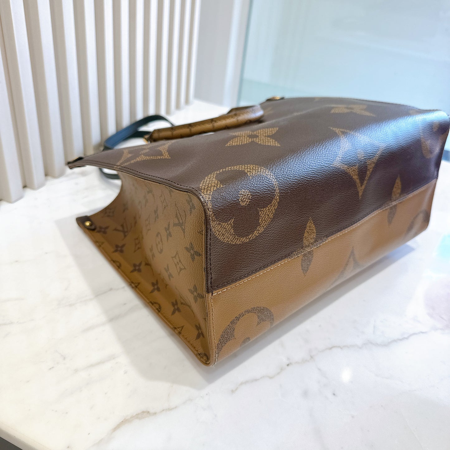 LV On The Go MM in Reverse Monogram