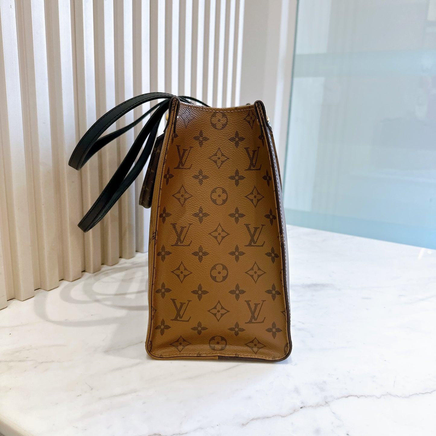 LV On The Go MM in Reverse Monogram