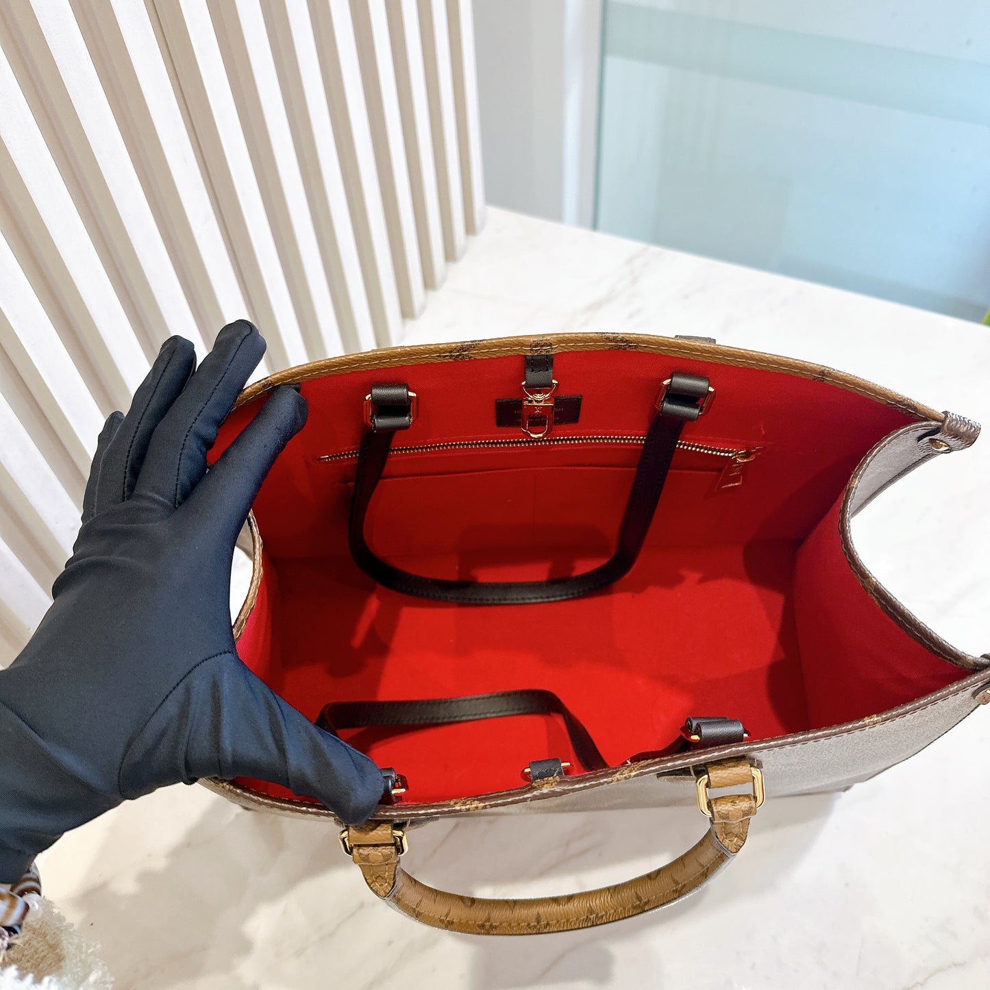 LV On The Go MM in Reverse Monogram