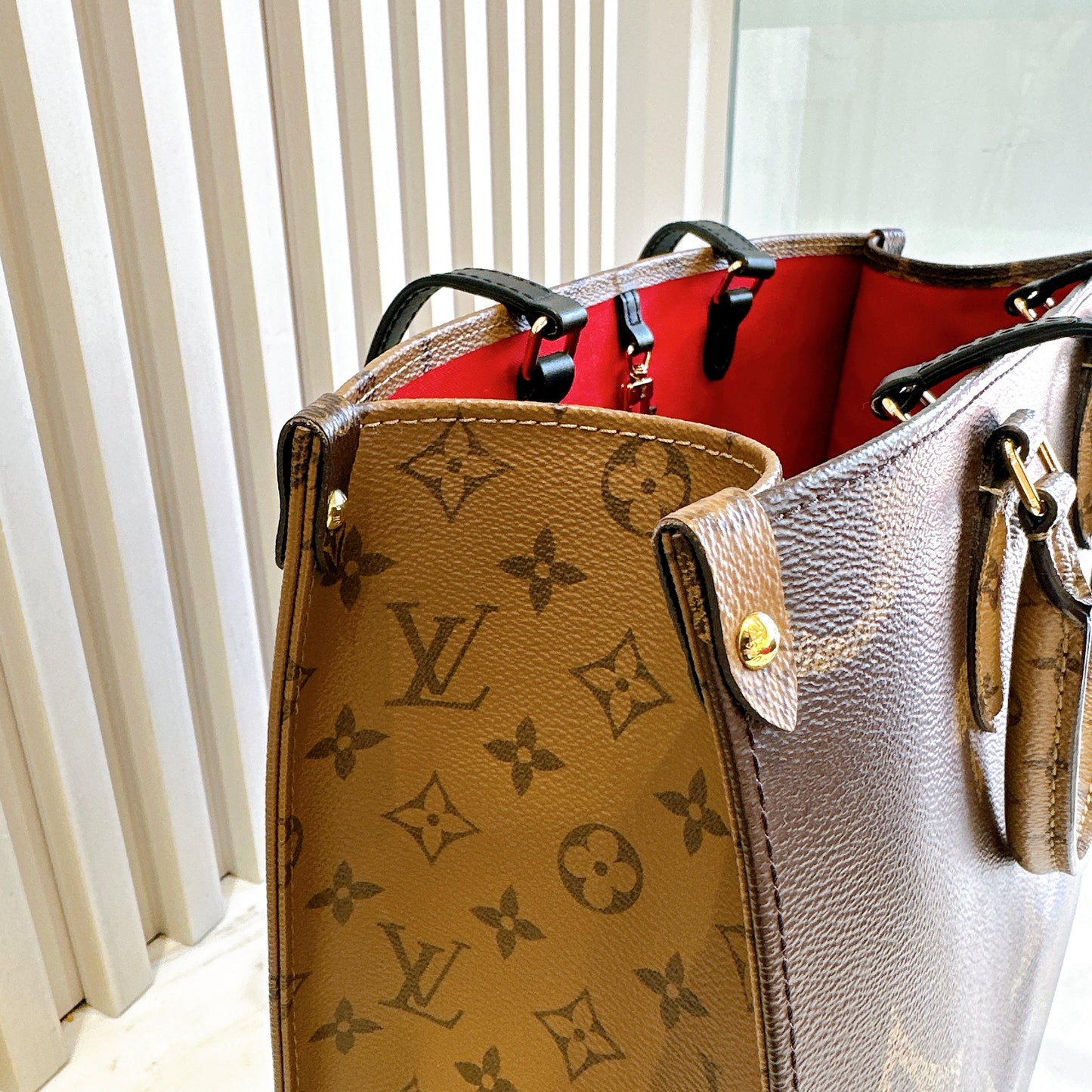 LV On The Go MM in Reverse Monogram